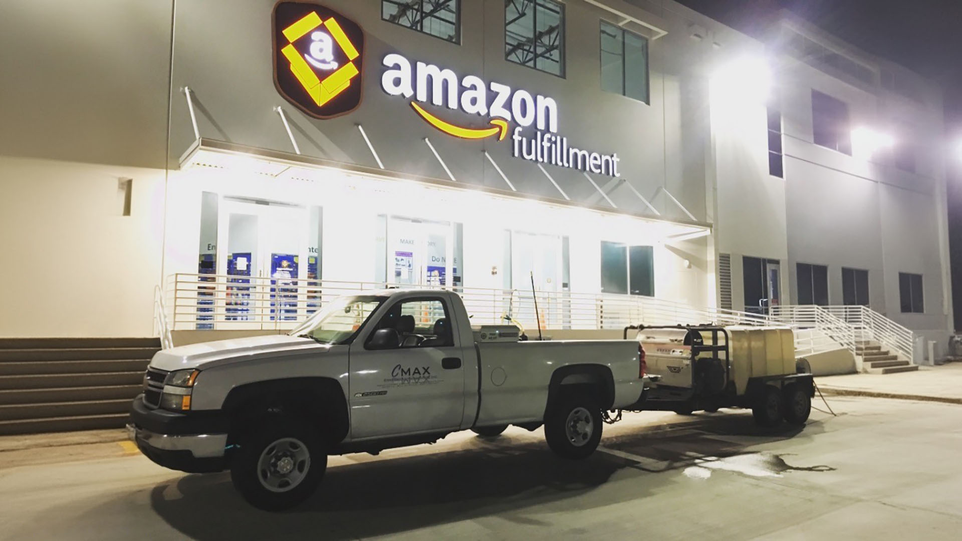 cmax-pick-up-truck-with-pressure-washer-trailer-at-amazon-fulfillment-center