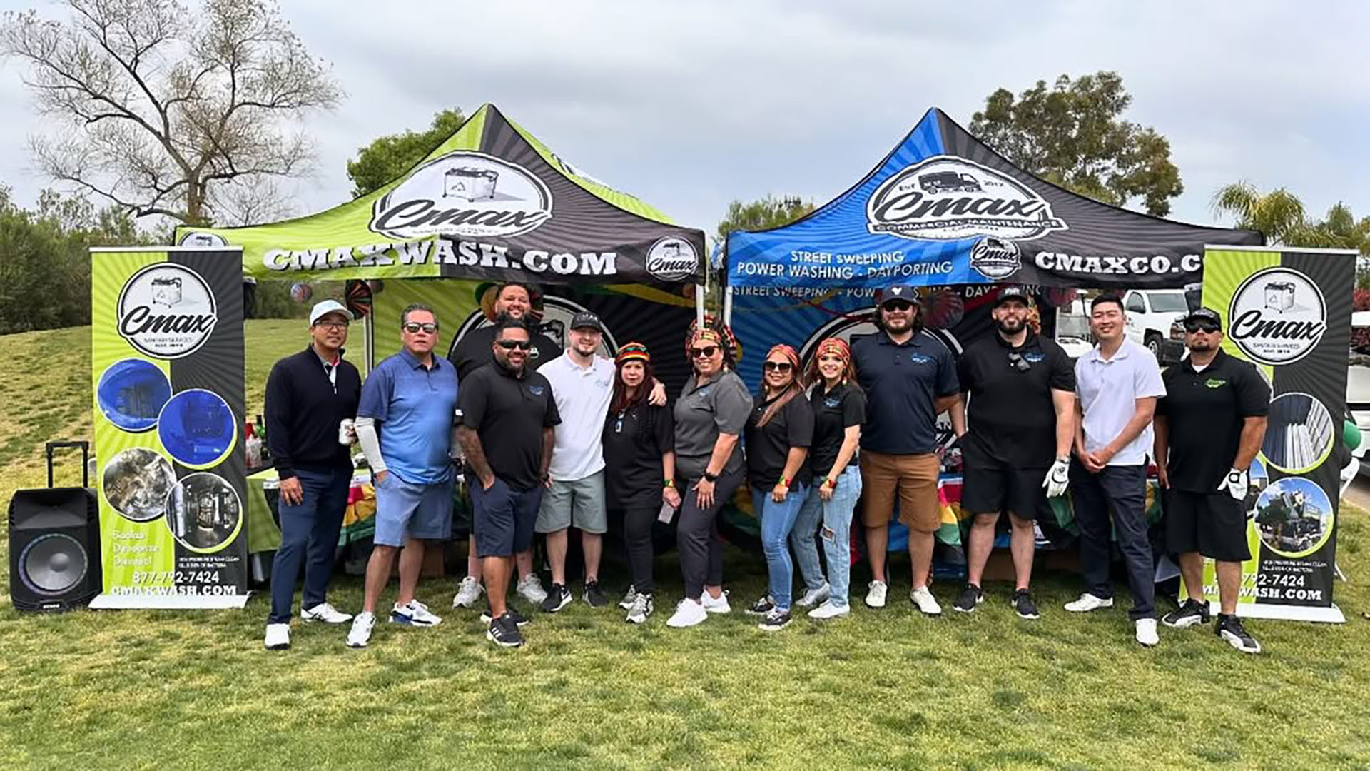 cmax-team-group-photo-company-tents-golf-event